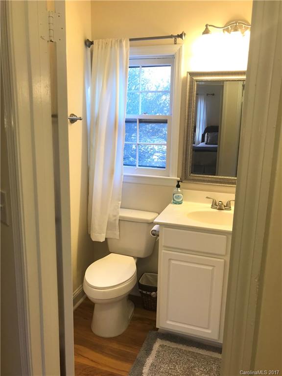 5941 Quail Hollow Road Charlotte, NC 28210 - Photo 12 of 20 a bathroom with a toilet sink and a mirror