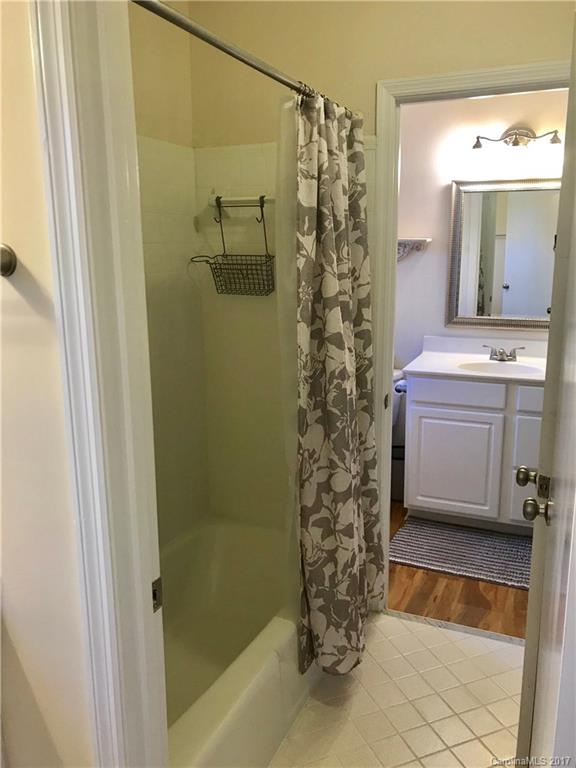 5941 Quail Hollow Road Charlotte, NC 28210 - Photo 14 of 20 a bathroom with a sink a toilet and shower