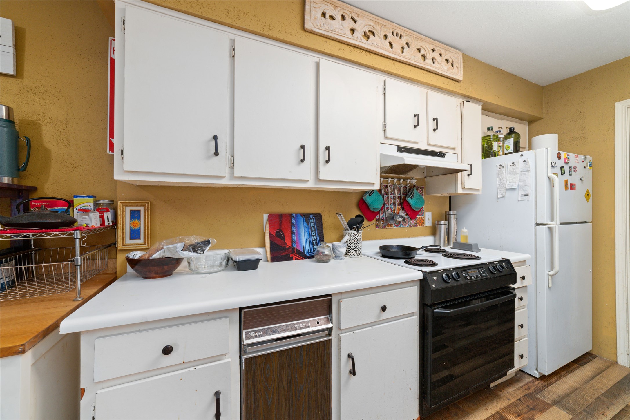 5800 Lumberdale Road, Unit 55 Houston, TX 77092 - Photo 16 of 34 a kitchen with stainless steel appliances granite countertop a refrigerator stove and white cabinets