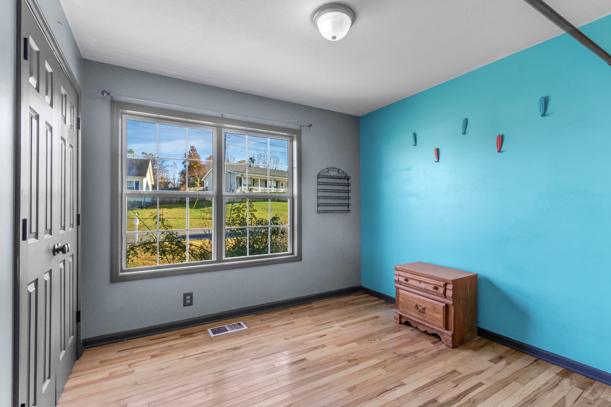 2883 Rome Lane Clarksville, TN 37040 - Photo 15 of 23 a view of an empty room with window and wooden floor