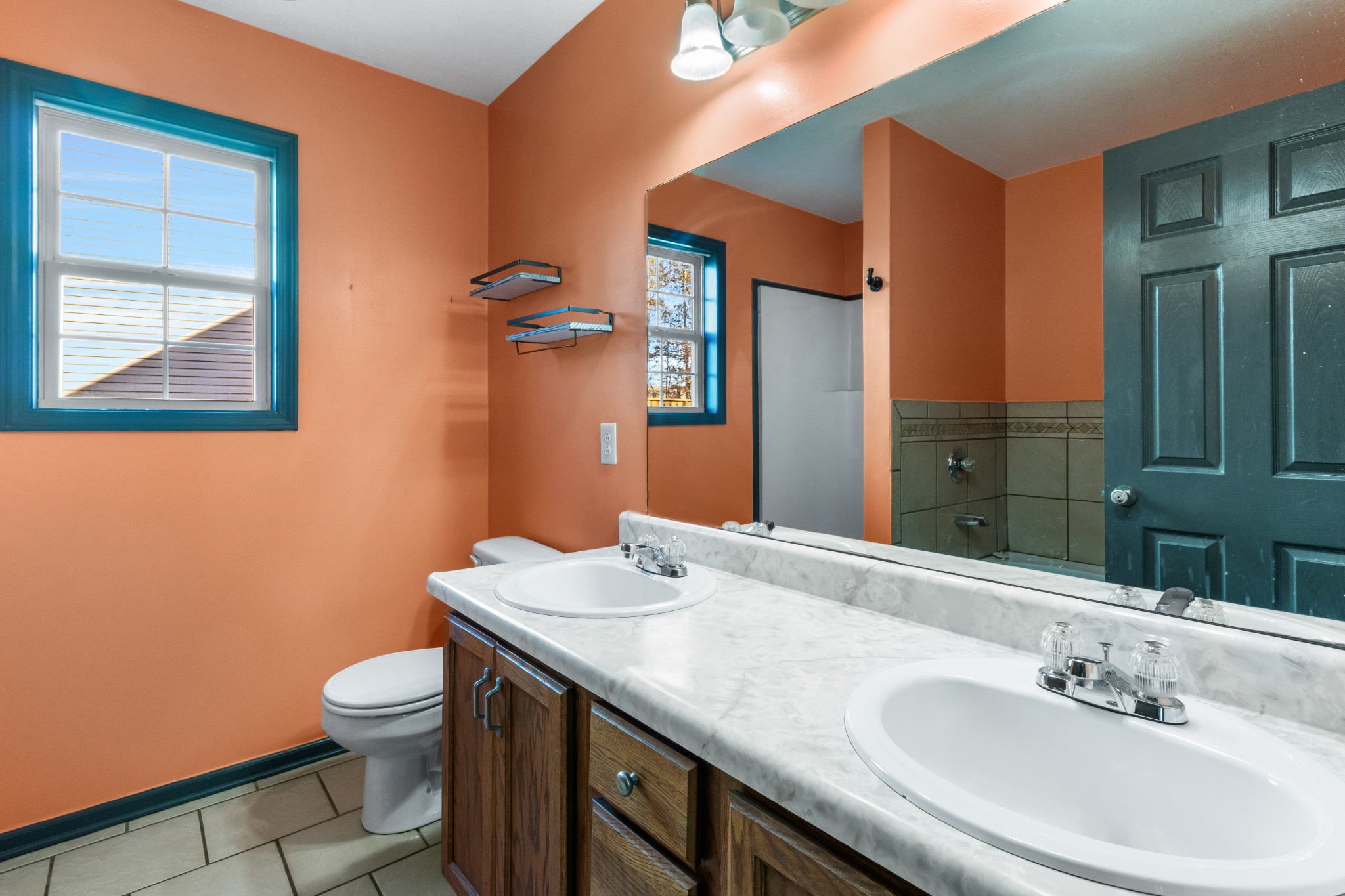 2883 Rome Lane Clarksville, TN 37040 - Photo 19 of 23 a bathroom with a granite countertop sink a toilet and a mirror