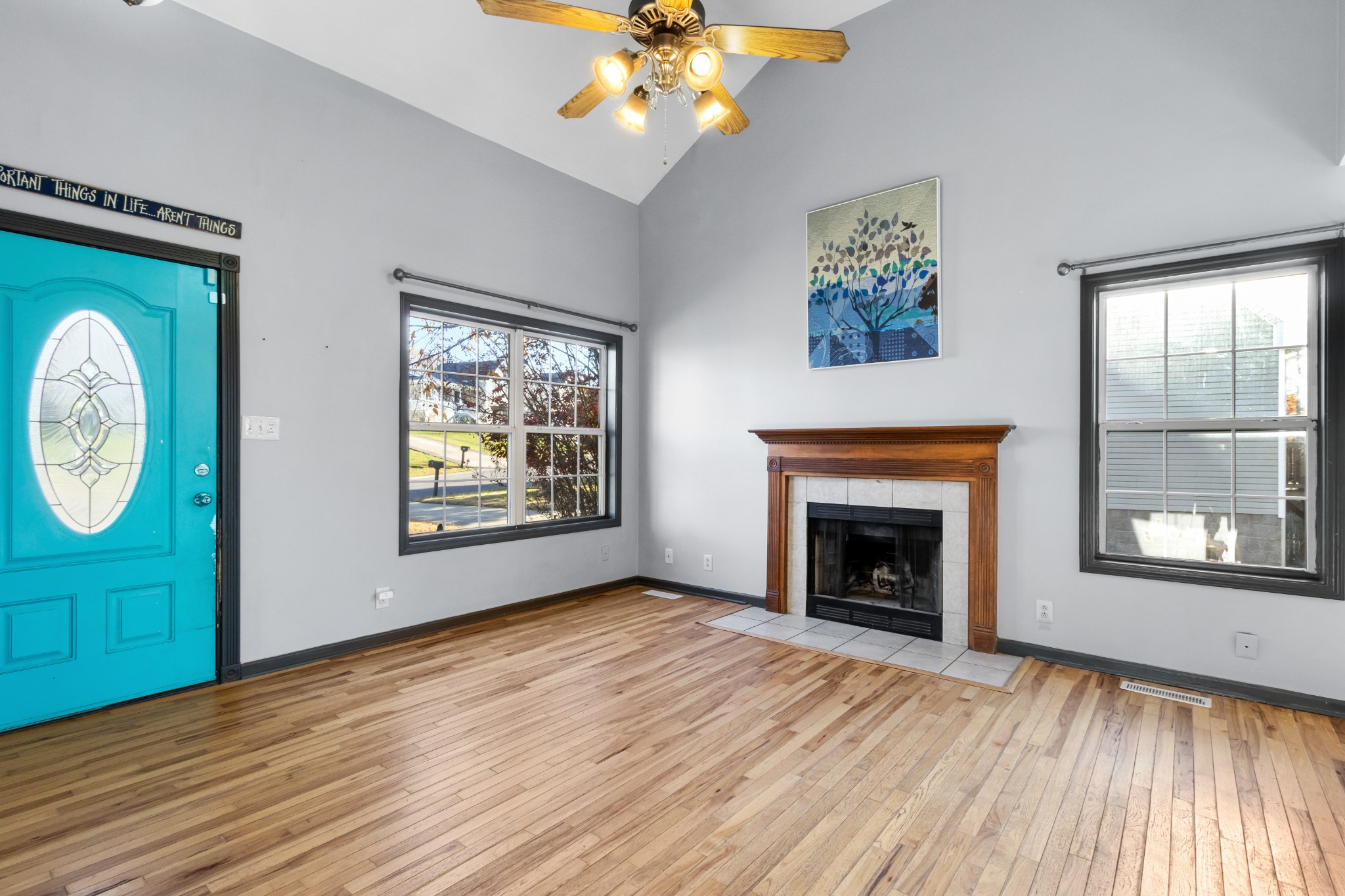 2883 Rome Lane Clarksville, TN 37040 - Photo 3 of 23 wooden floor fireplace and windows in an empty room