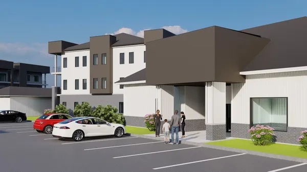 a view of a cars park in front of a building