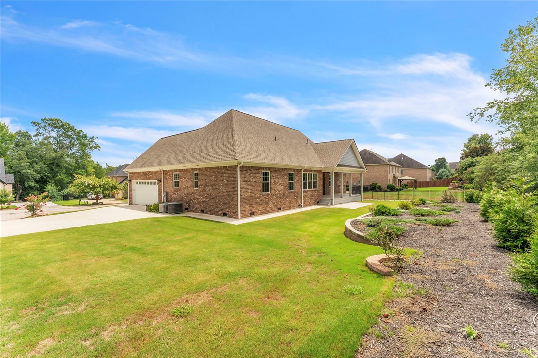 1015 Winmar Drive Anderson, SC 29621 - Photo 41 of 49 This residence showcases a classic brick exterior with a large, inviting yard and covered porch.