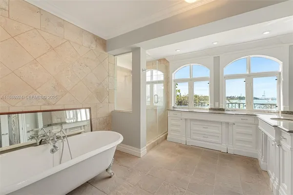 a bathroom with a bathtub and a sink