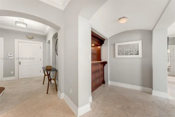 a view of a livingroom with wooden floor and windows with curtains