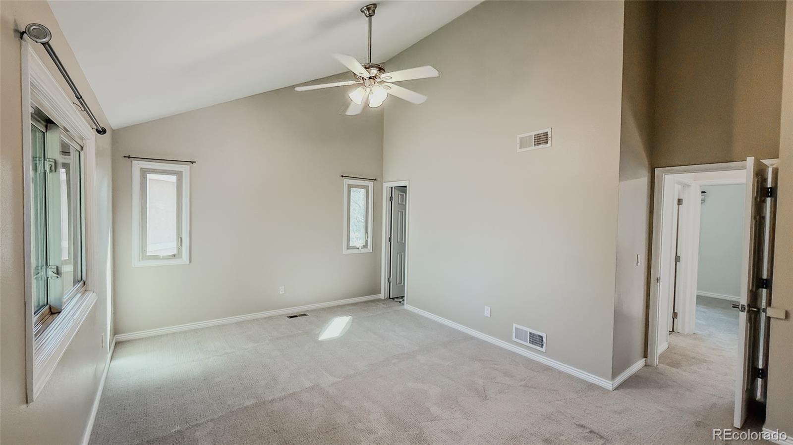 15789 Sandtrap Way Morrison, CO 80465 - Photo 17 of 42 an empty room with fan