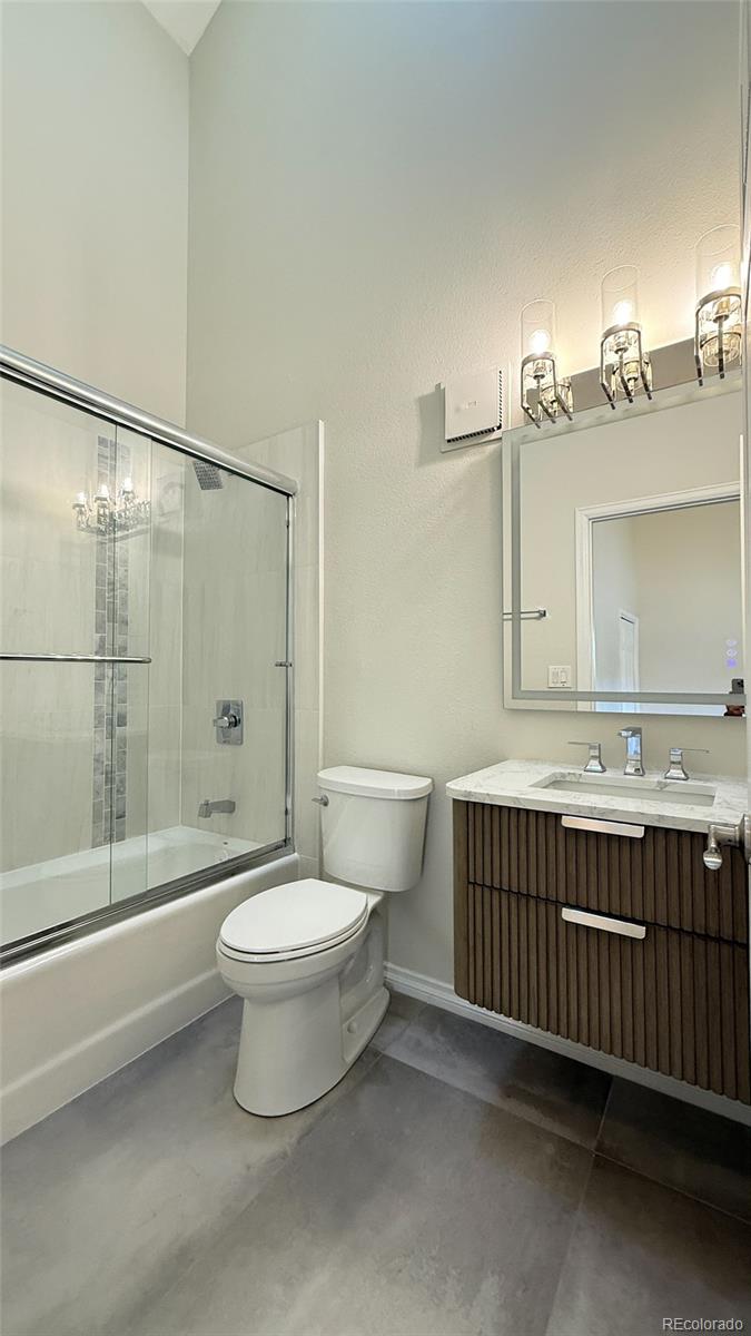 15789 Sandtrap Way Morrison, CO 80465 - Photo 20 of 42 a bathroom with a sink toilet and shower