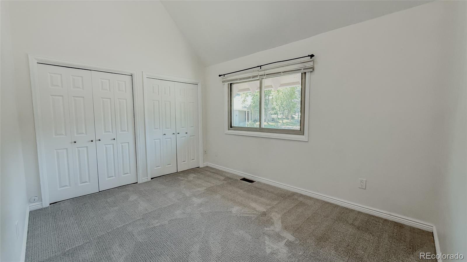 15789 Sandtrap Way Morrison, CO 80465 - Photo 21 of 42 an empty room with windows