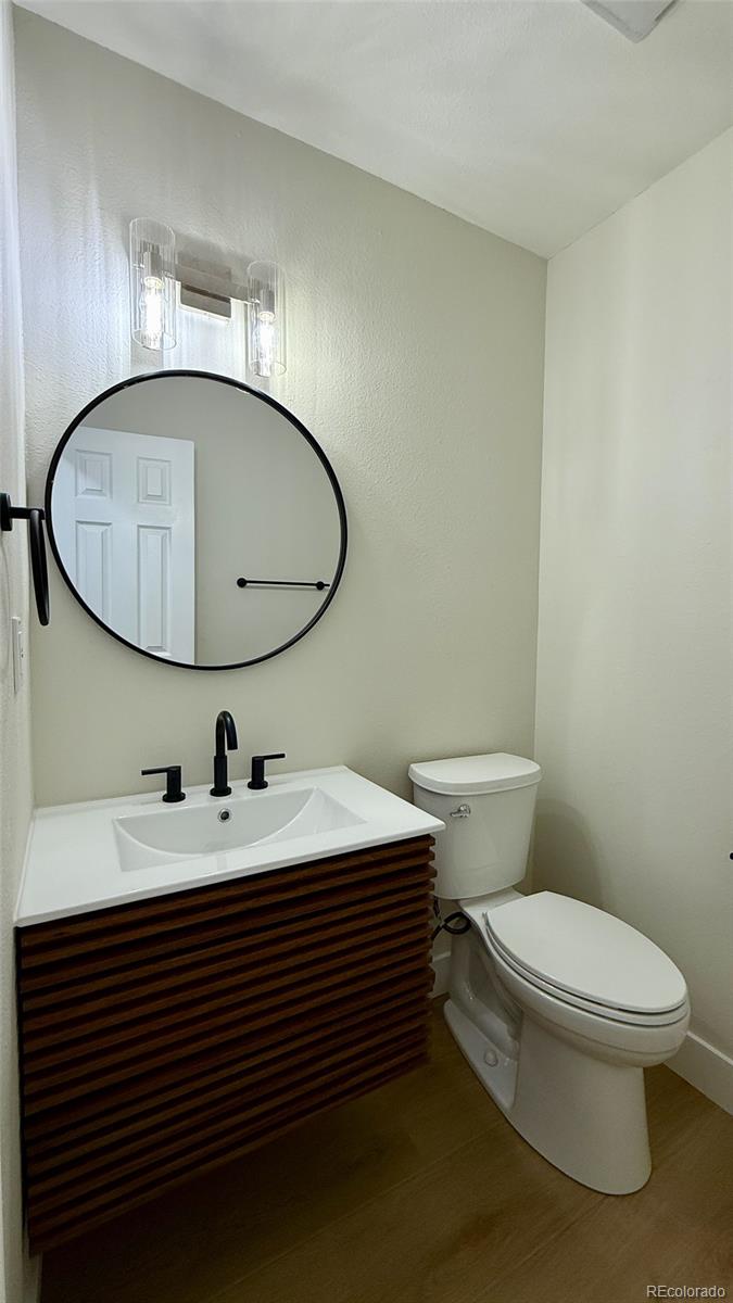 15789 Sandtrap Way Morrison, CO 80465 - Photo 27 of 42 a bathroom with a sink and a mirror