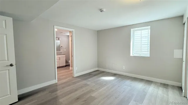 a bathroom with a toilet a sink and shower