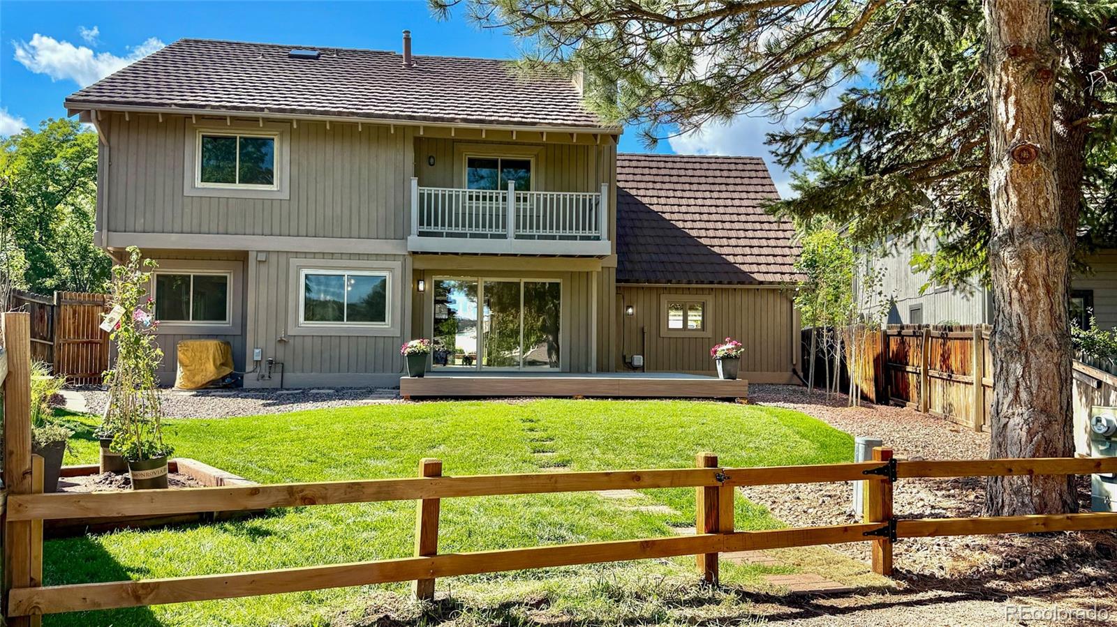 15789 Sandtrap Way Morrison, CO 80465 - Photo 39 of 42 a front view of a house with garden