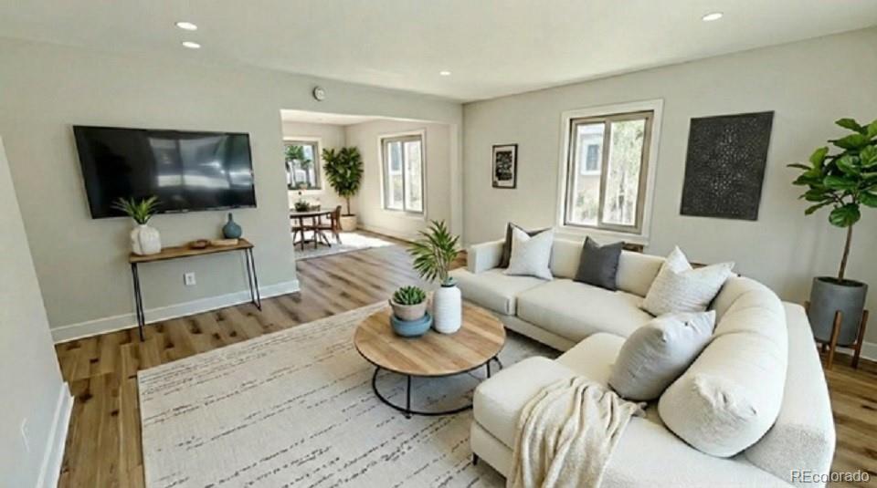 15789 Sandtrap Way Morrison, CO 80465 - Photo 5 of 42 a living room with furniture and a flat screen tv