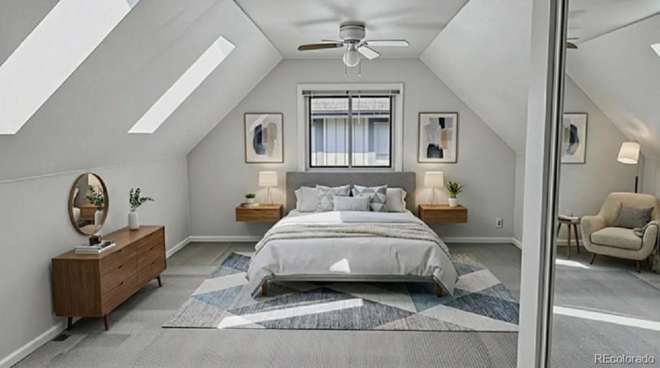 15789 Sandtrap Way Morrison, CO 80465 - Photo 9 of 42 a spacious bedroom with a bed a mirror on dresser and a chandelier