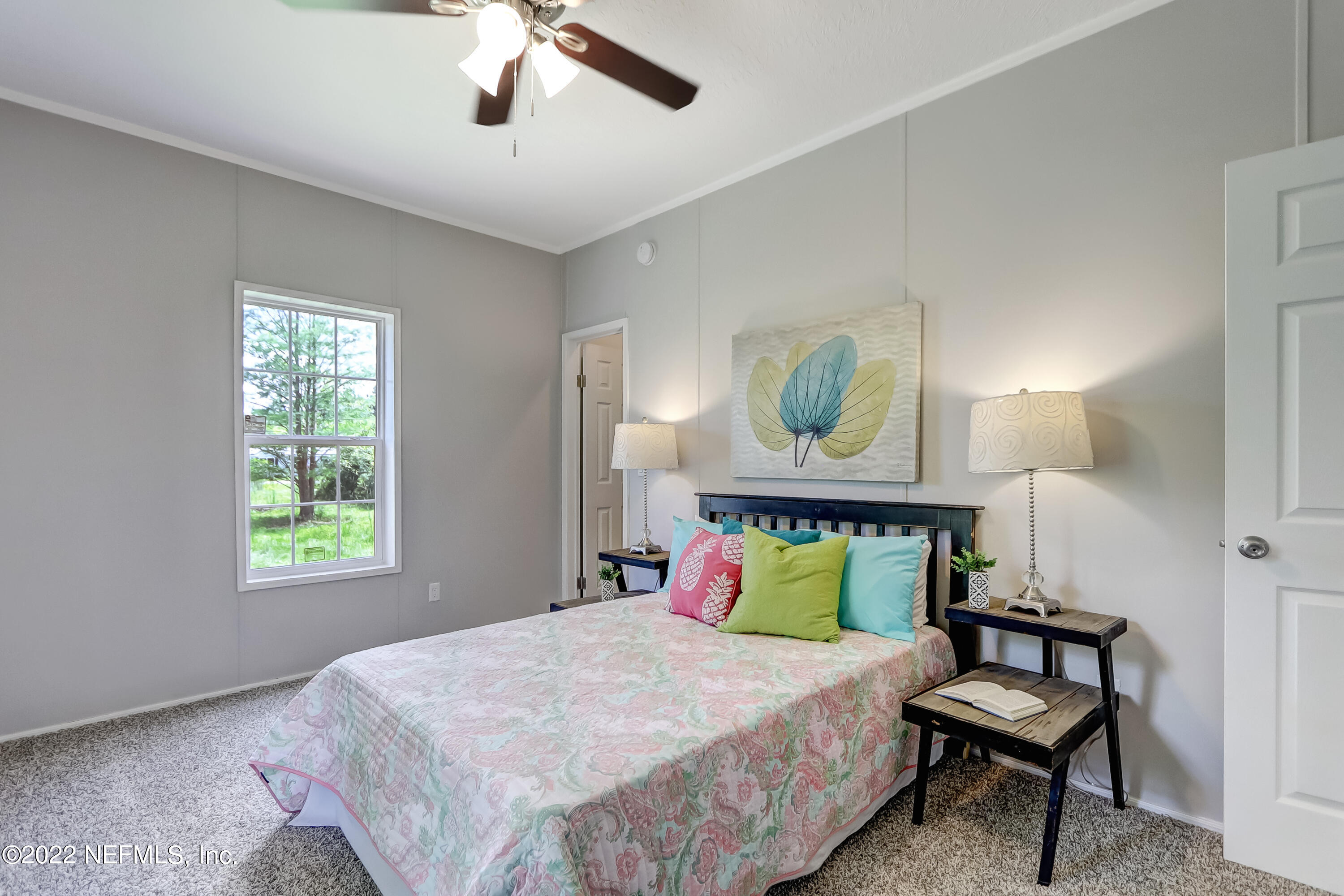 54267 Heller Road Callahan, FL 32011 - Photo 32 of 37 a bedroom with a bed and window