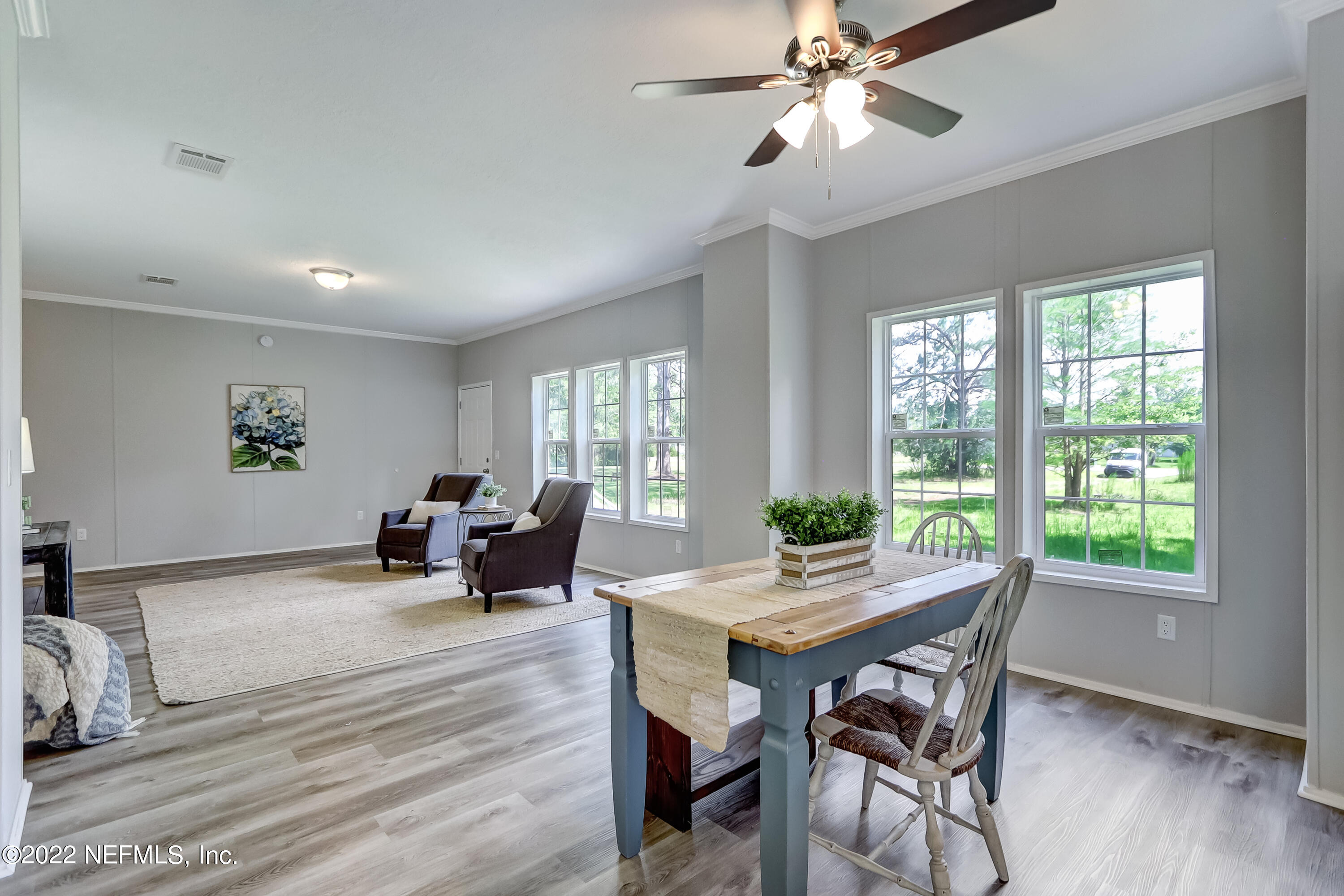 54267 Heller Road Callahan, FL 32011 - Photo 10 of 37 a view of a dining room with furniture window and wooden floor