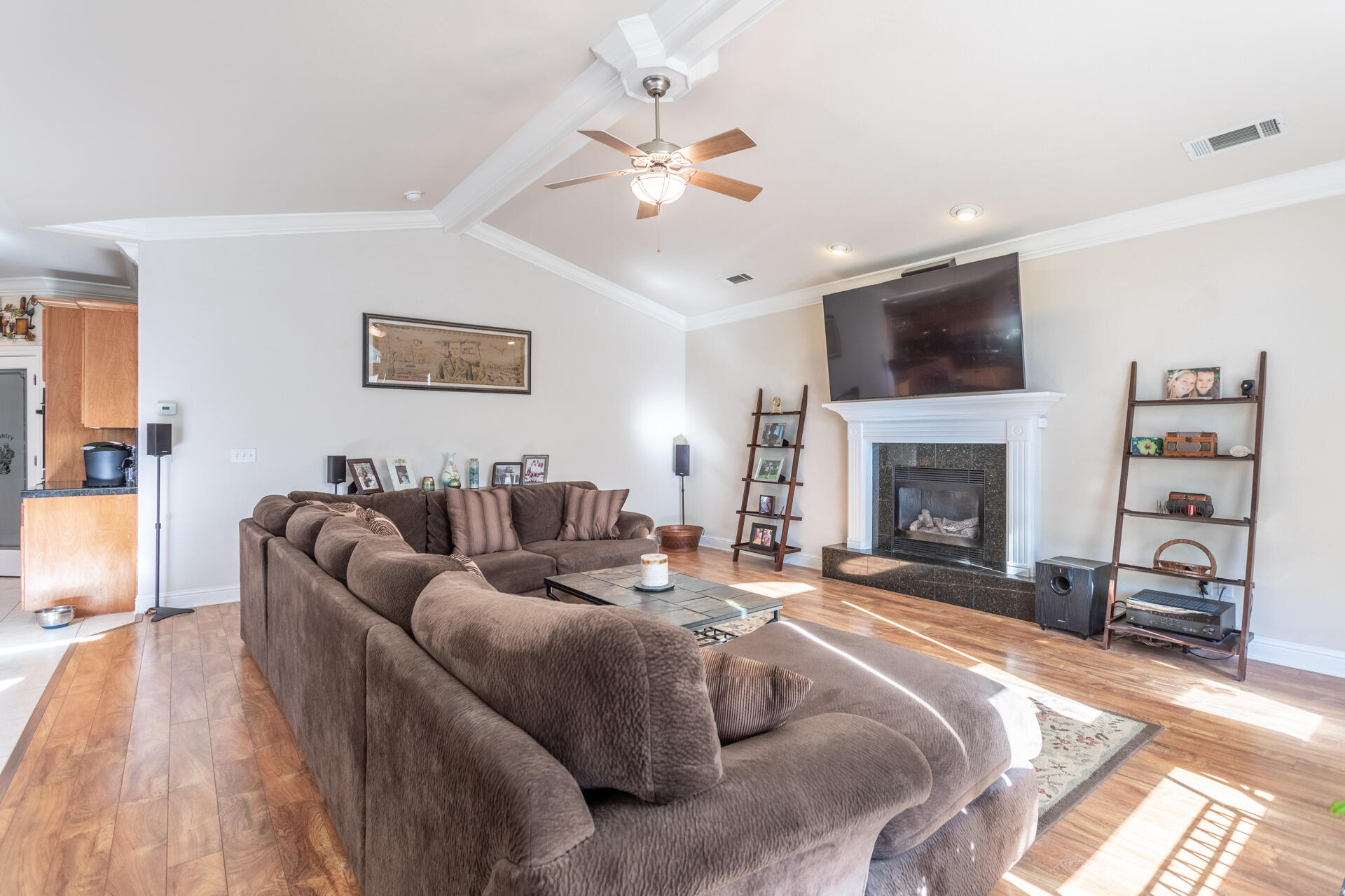 2877 Green Riffle Road Redding, CA 96002 - Photo 11 of 37 a living room with furniture a flat screen tv and a fireplace