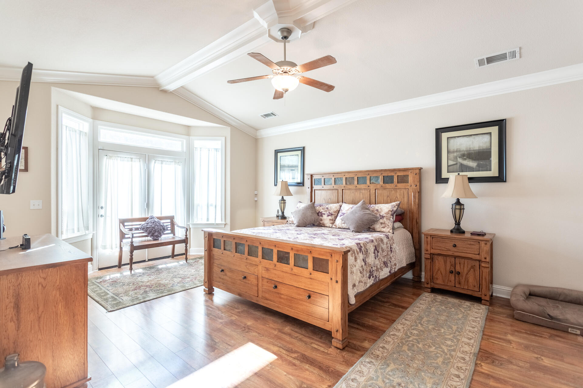 2877 Green Riffle Road Redding, CA 96002 - Photo 15 of 37 a bed room with a bed and a chandelier