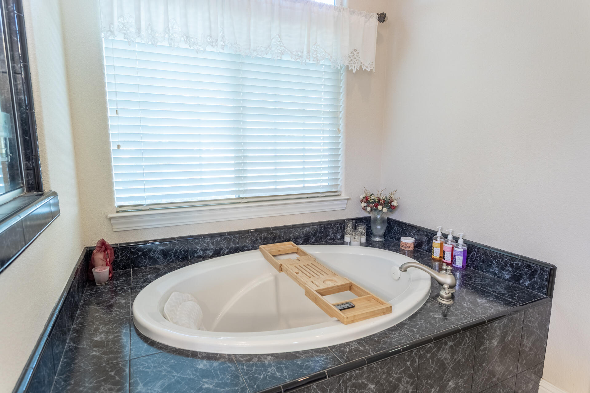 2877 Green Riffle Road Redding, CA 96002 - Photo 18 of 37 a bathroom with a tub and a window