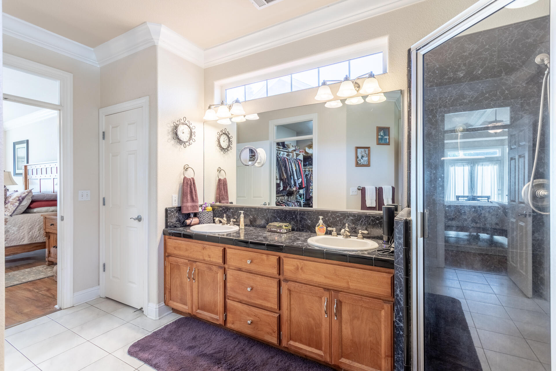 2877 Green Riffle Road Redding, CA 96002 - Photo 19 of 37 a bathroom with a double vanity sink and a mirror
