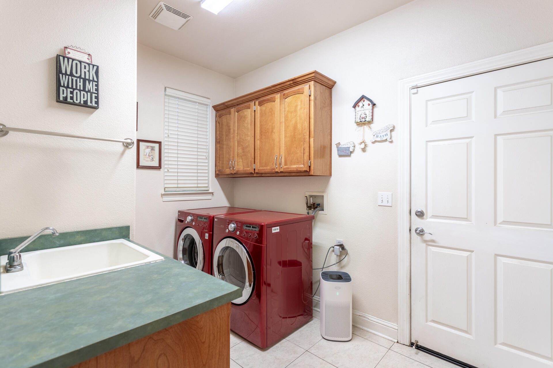 2877 Green Riffle Road Redding, CA 96002 - Photo 23 of 37 a utility room with cabinets washer and dryer