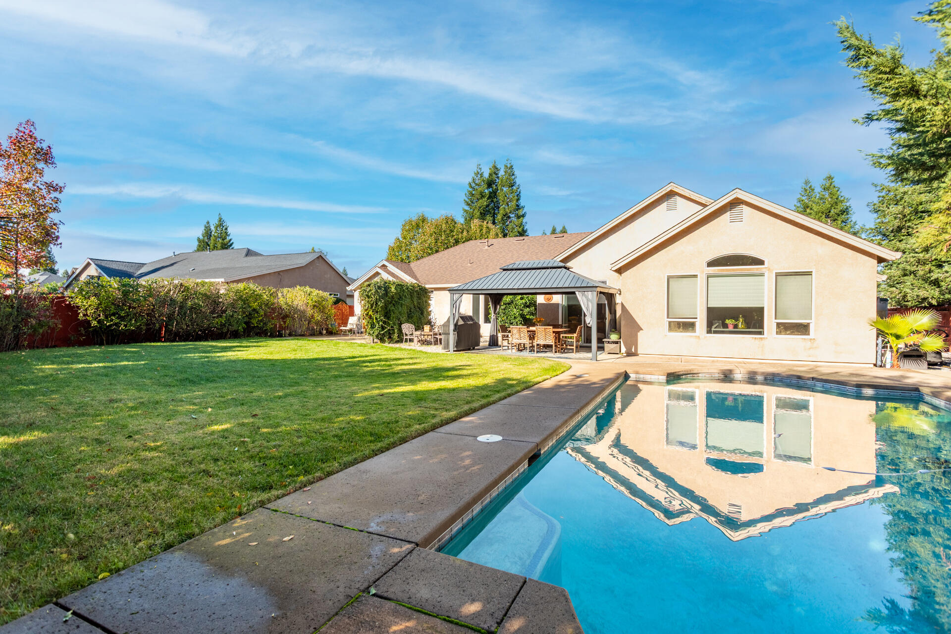 2877 Green Riffle Road Redding, CA 96002 - Photo 31 of 37 a front view of a house with a yard