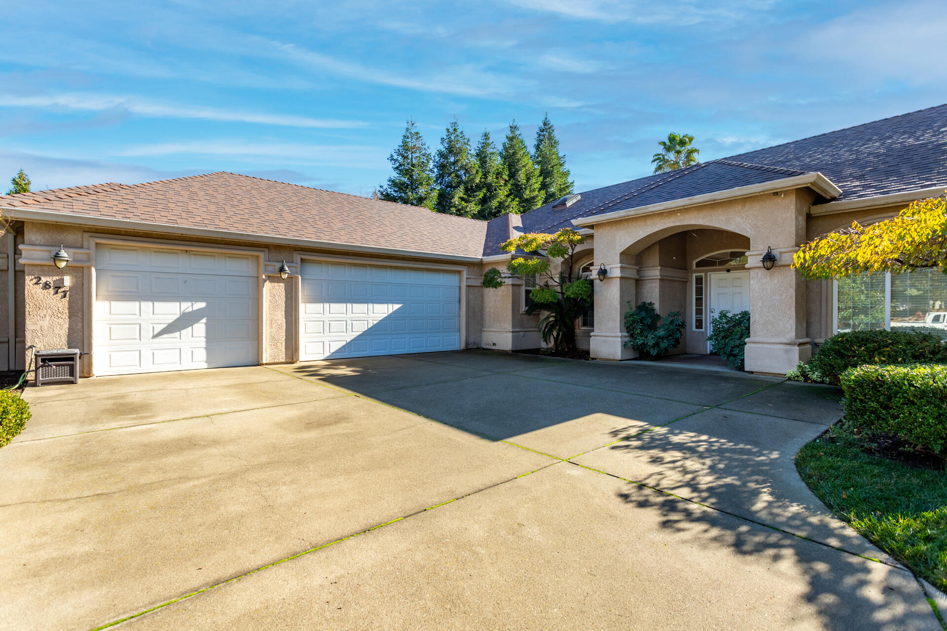 2877 Green Riffle Road Redding, CA 96002 - Photo 36 of 37 a front view of a house with a yard and garage
