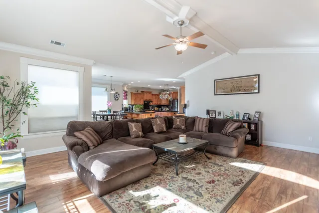 a living room with furniture and a rug