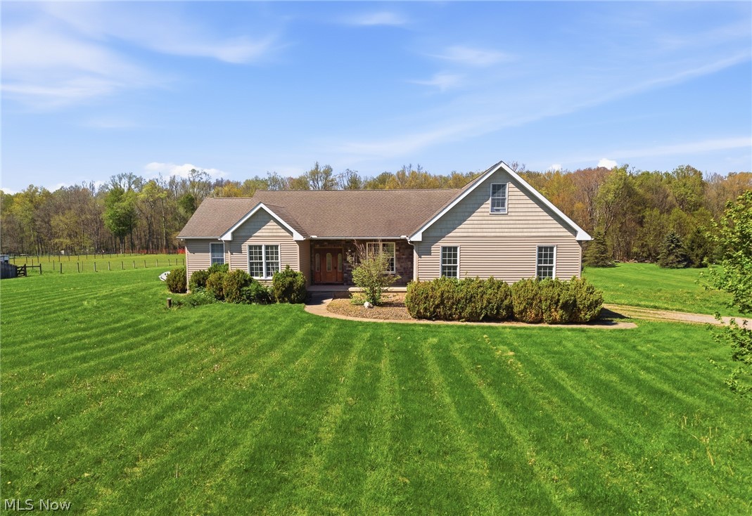 5859 Winchell Road Hiram, OH 44234 - Photo 1 of 4 Ranch-style residence featuring neutral siding and a gabled roofline