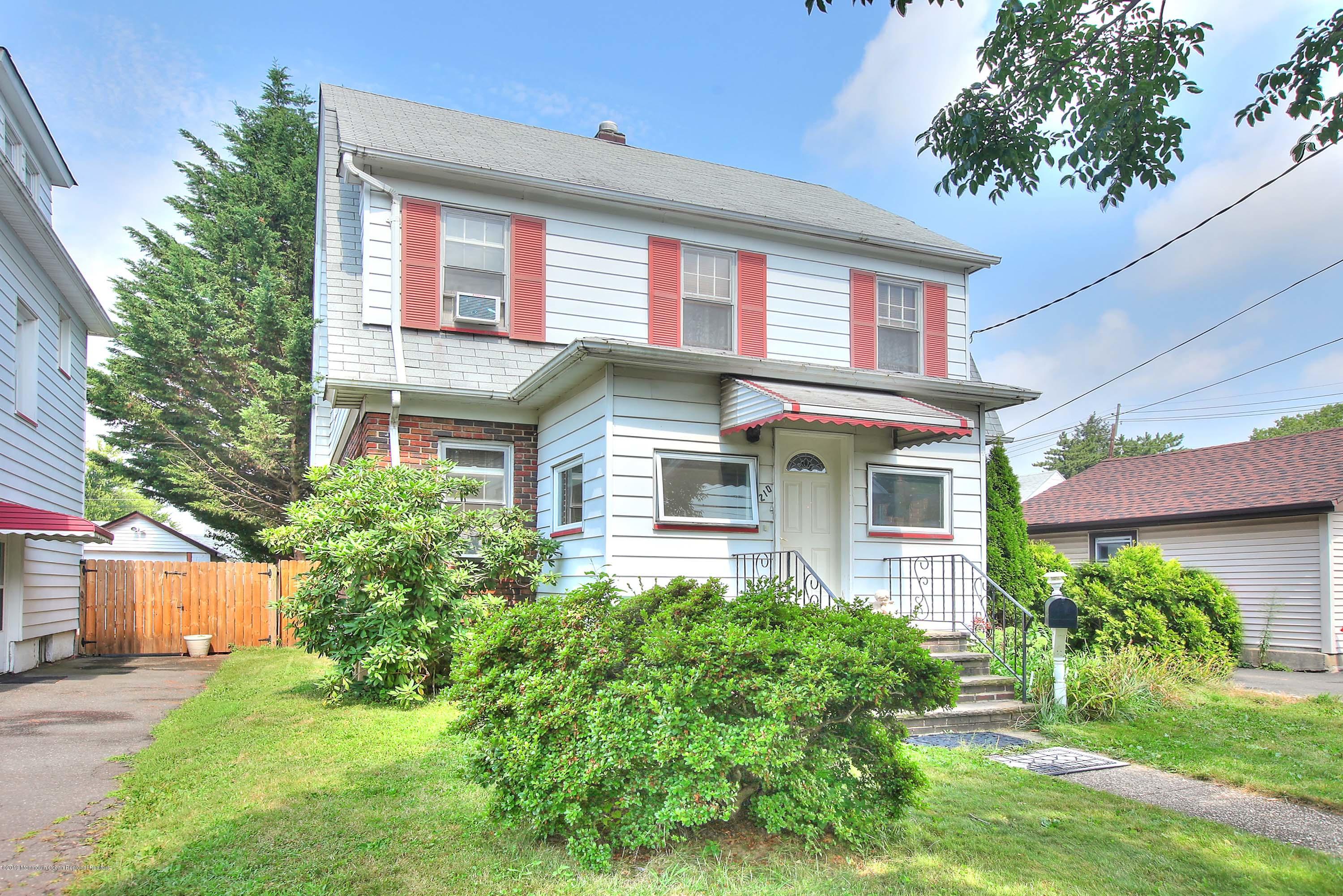 210 Hillside Road Linden, NJ 07036 - Photo 1 of 25 front view of a house with a yard