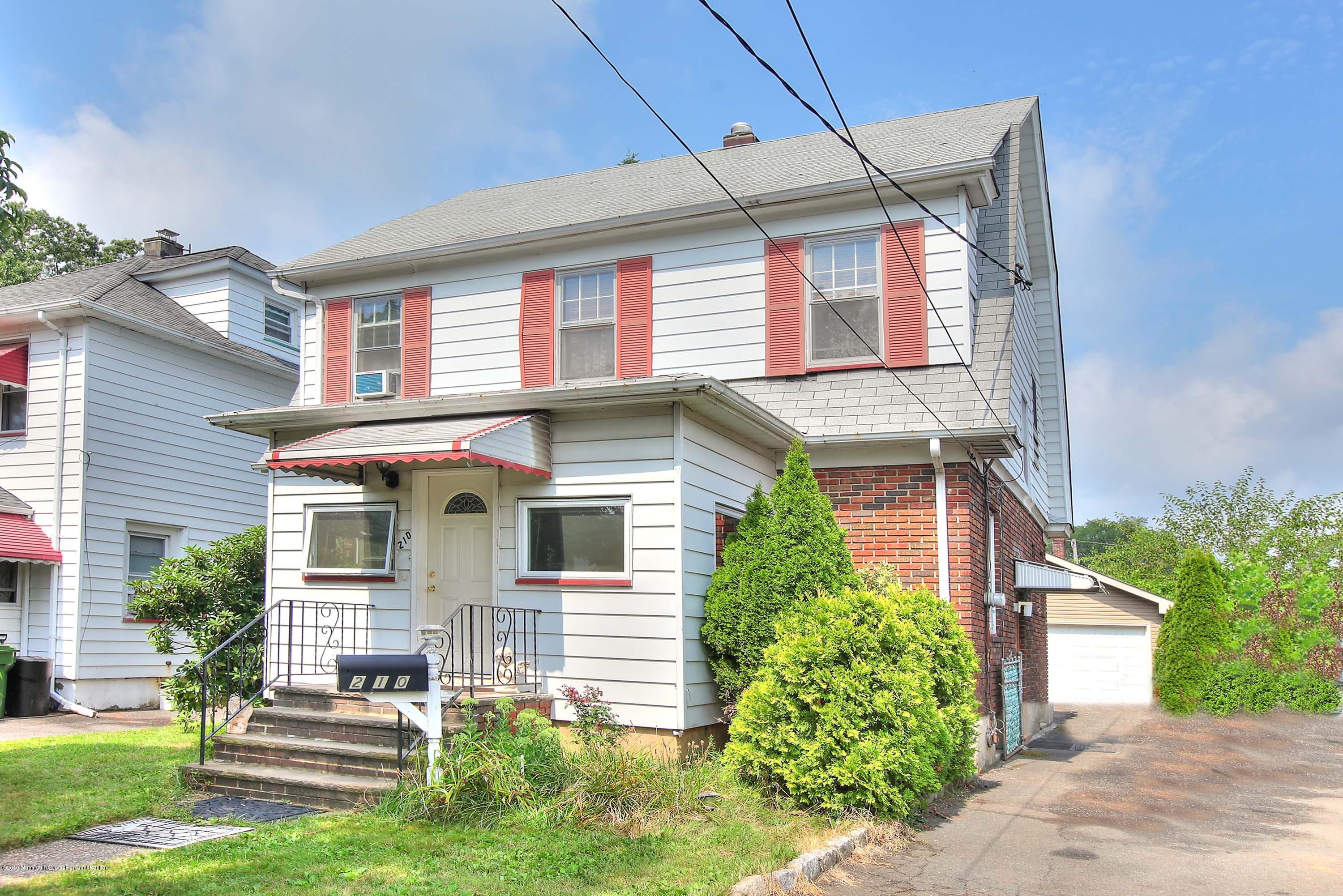 210 Hillside Road Linden, NJ 07036 - Photo 2 of 25 front view of a house with a yard