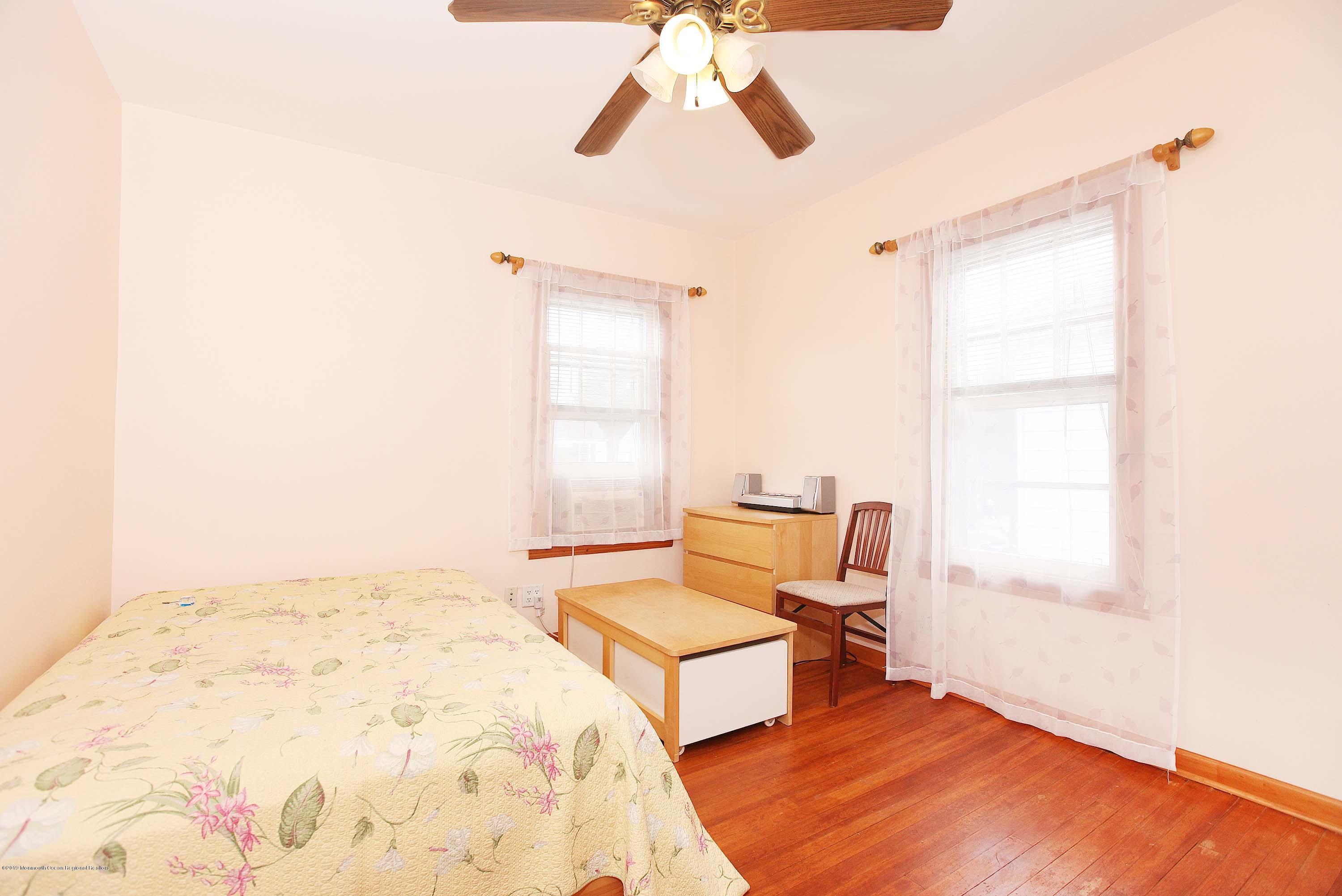 210 Hillside Road Linden, NJ 07036 - Photo 17 of 25 a living room with a bed furniture and a window