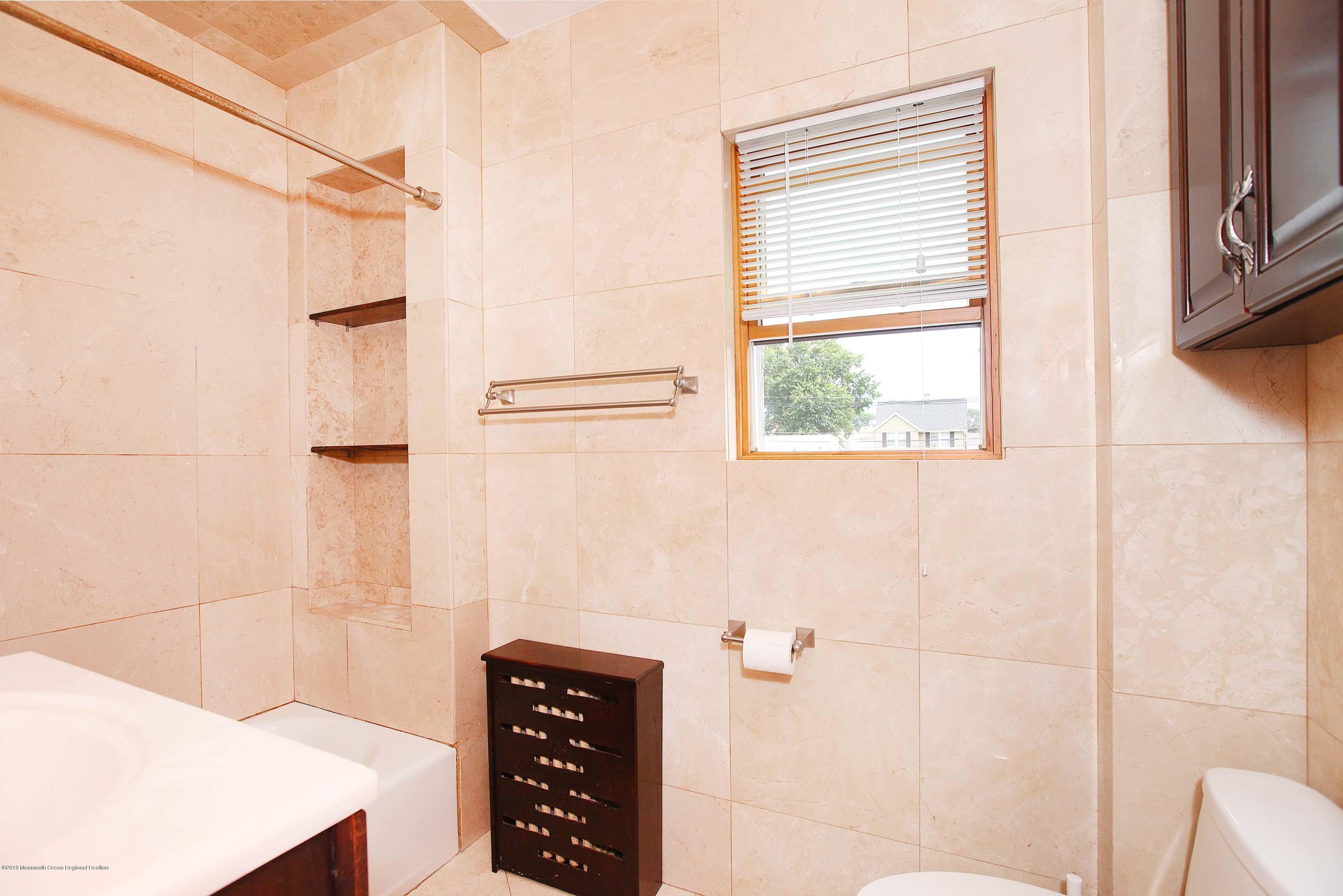 210 Hillside Road Linden, NJ 07036 - Photo 19 of 25 a bathroom with a shower and a sink