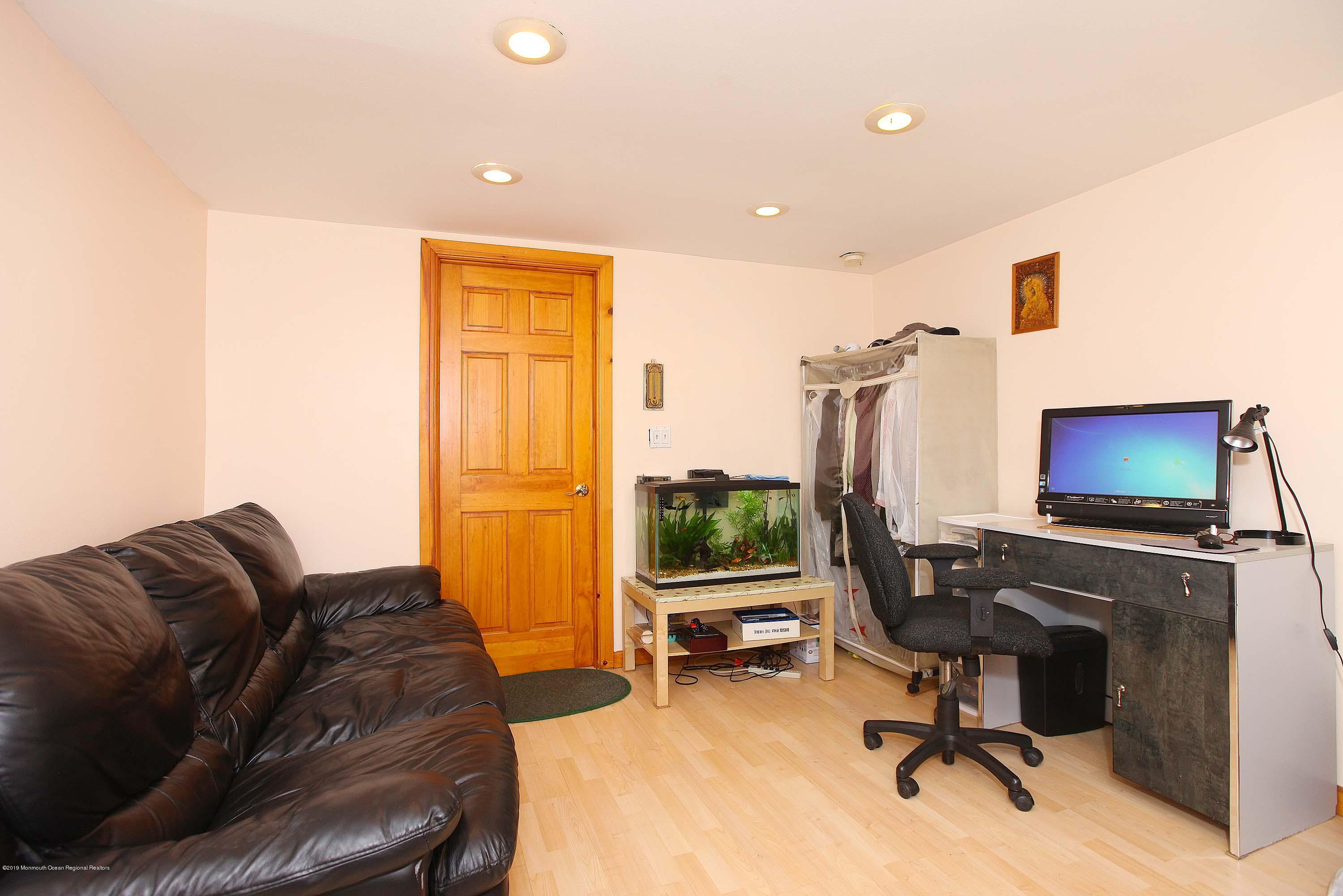 210 Hillside Road Linden, NJ 07036 - Photo 22 of 25 a livingroom with workspace and a couch