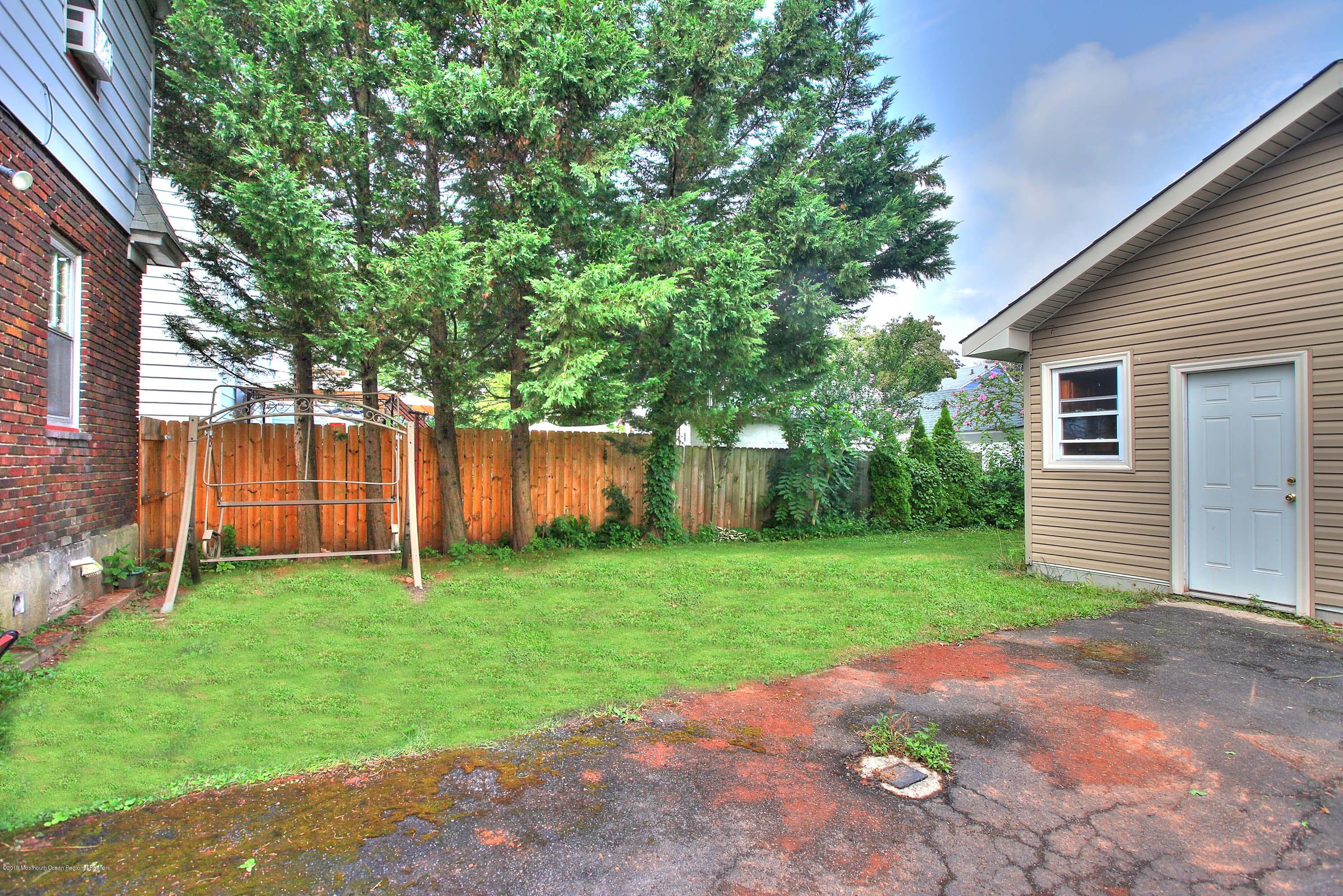 210 Hillside Road Linden, NJ 07036 - Photo 24 of 25 a view of a backyard with large trees