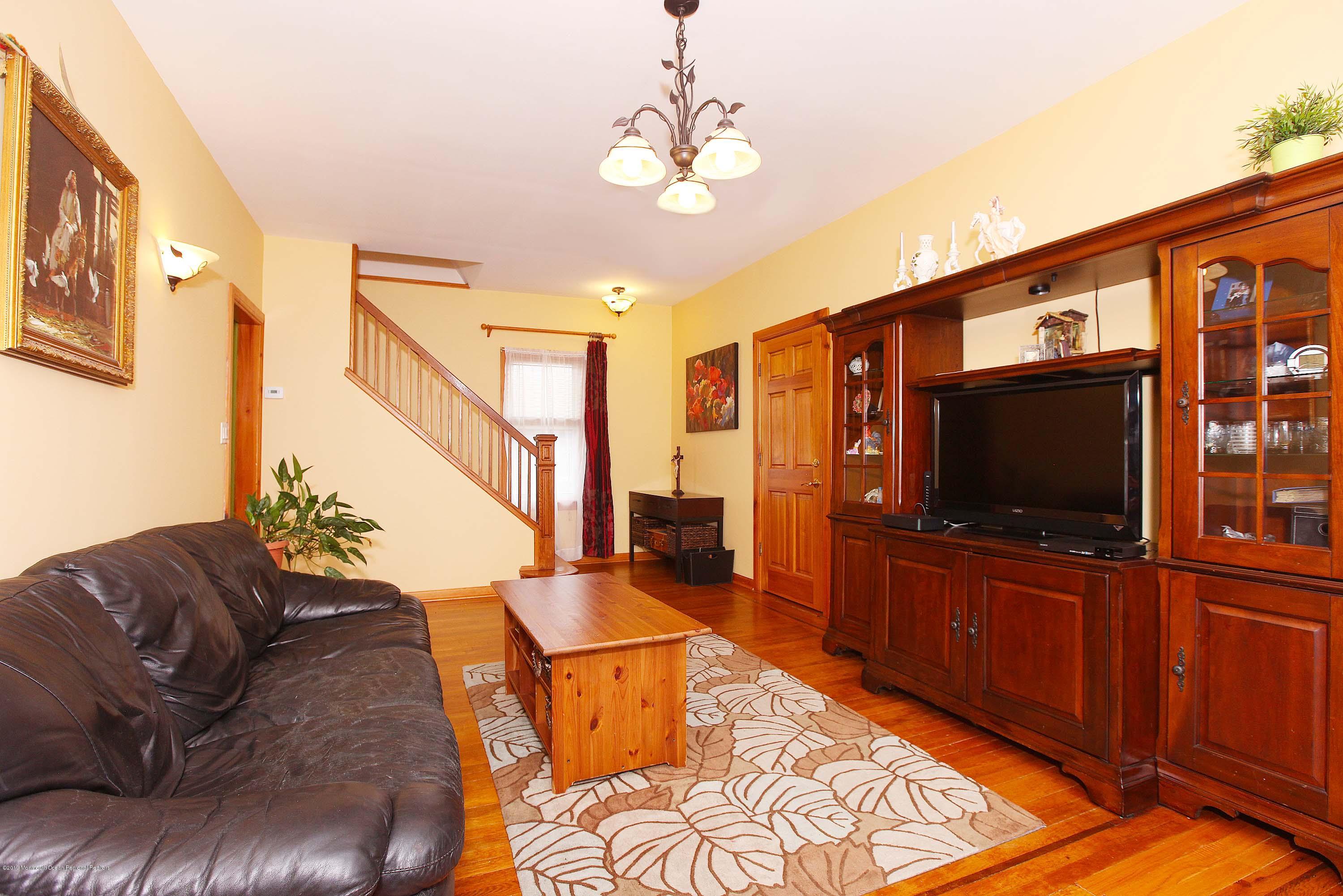 210 Hillside Road Linden, NJ 07036 - Photo 6 of 25 a living room with furniture and a flat screen tv