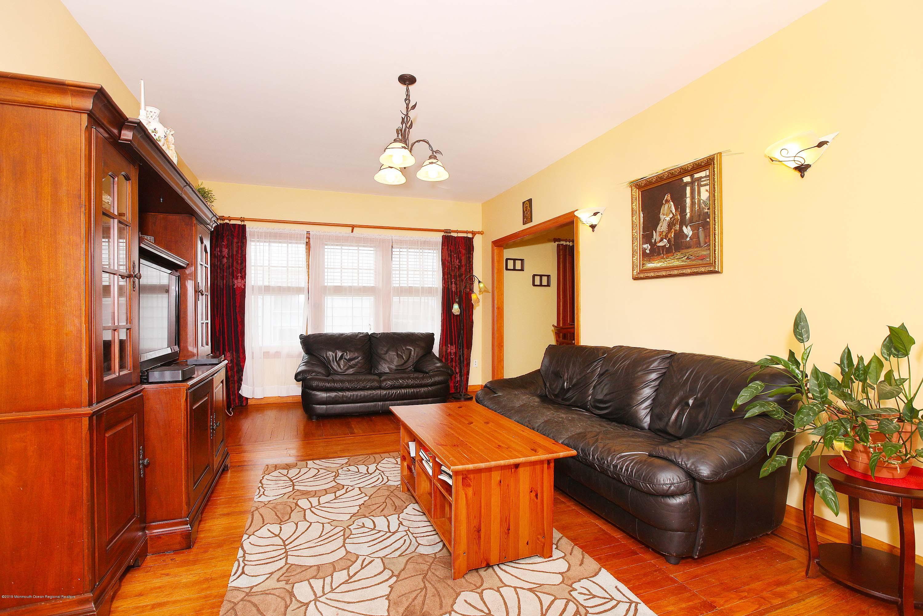 210 Hillside Road Linden, NJ 07036 - Photo 7 of 25 a living room with furniture a couch and a window