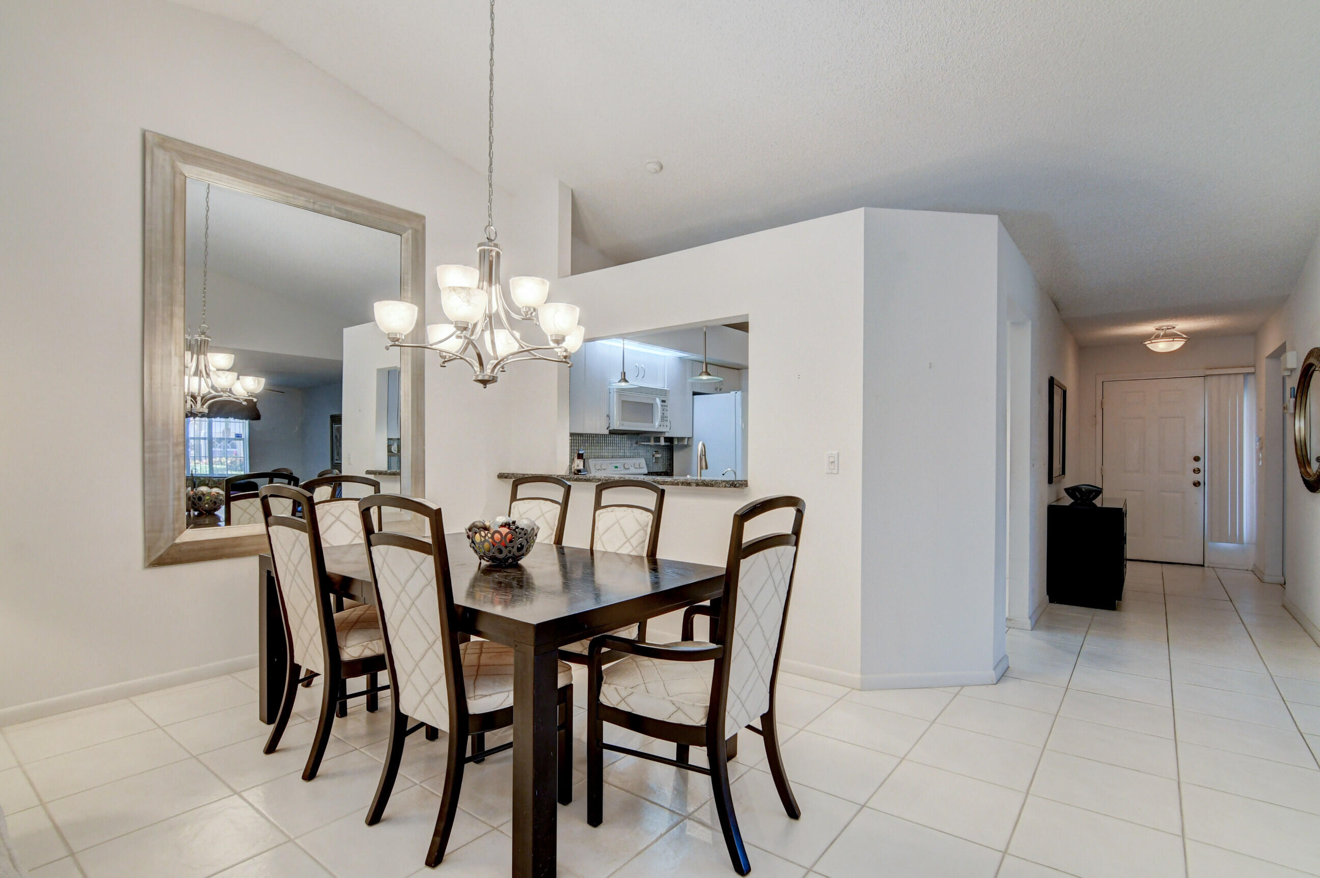 7566 Red Ruby Drive Delray Beach, FL 33446 - Photo 14 of 44 a dining room with furniture and window
