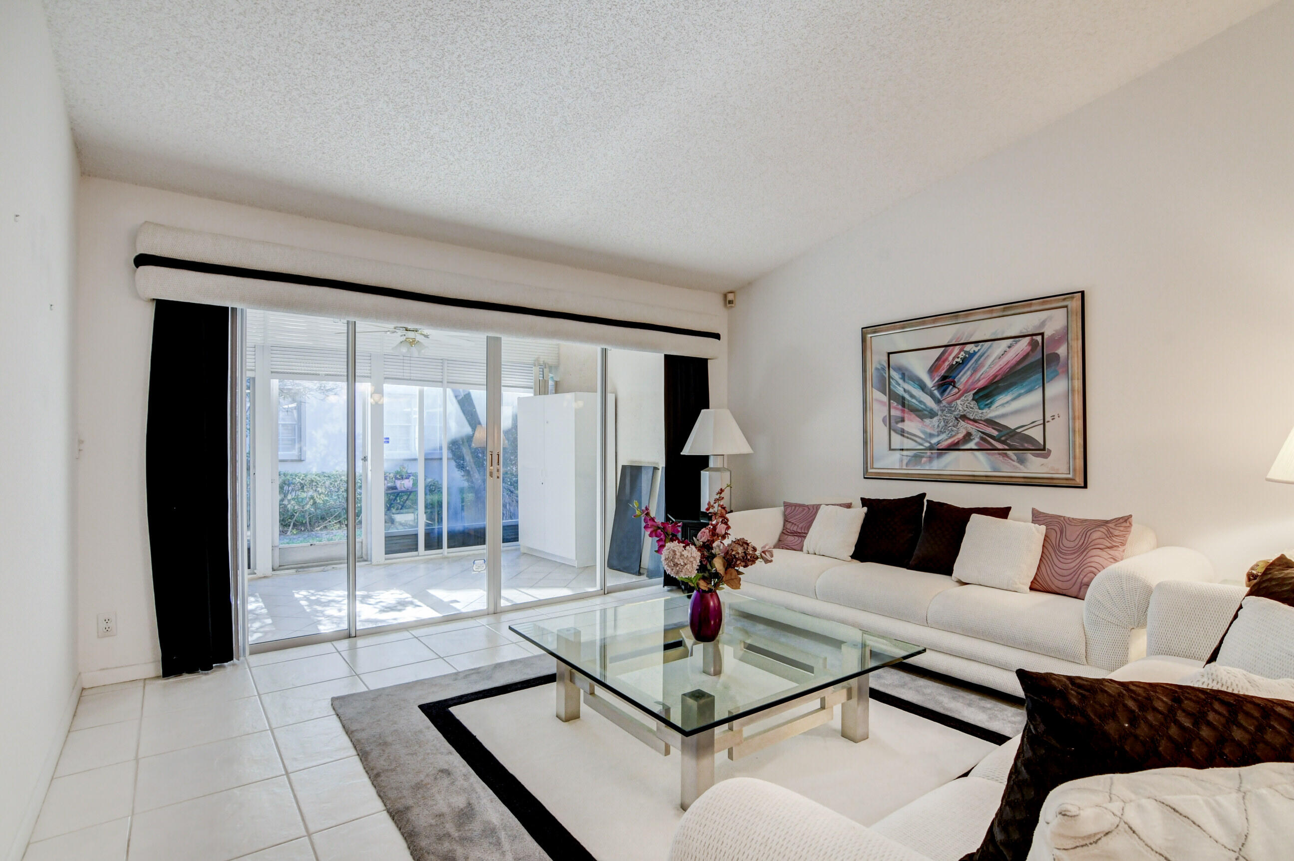 7566 Red Ruby Drive Delray Beach, FL 33446 - Photo 15 of 44 a living room with furniture and a large window