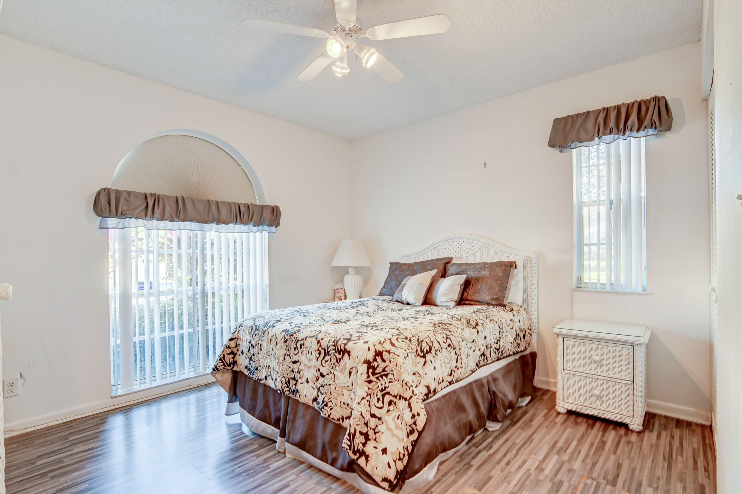 7566 Red Ruby Drive Delray Beach, FL 33446 - Photo 26 of 44 a bedroom with a bed and a window