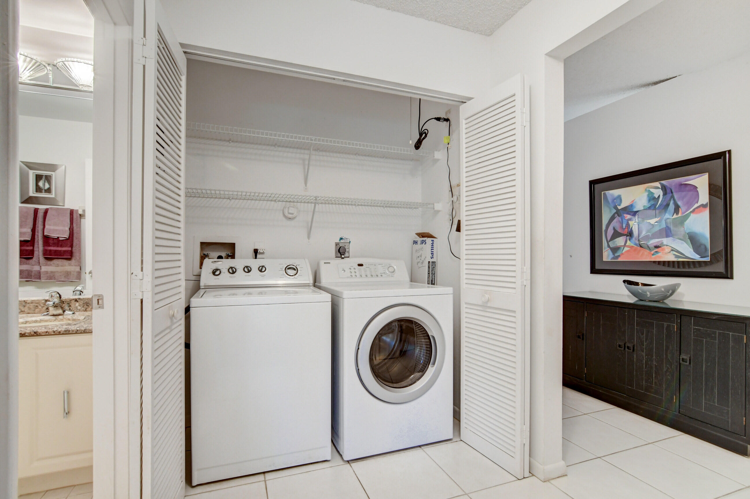7566 Red Ruby Drive Delray Beach, FL 33446 - Photo 30 of 44 a utility room with dryer and washer