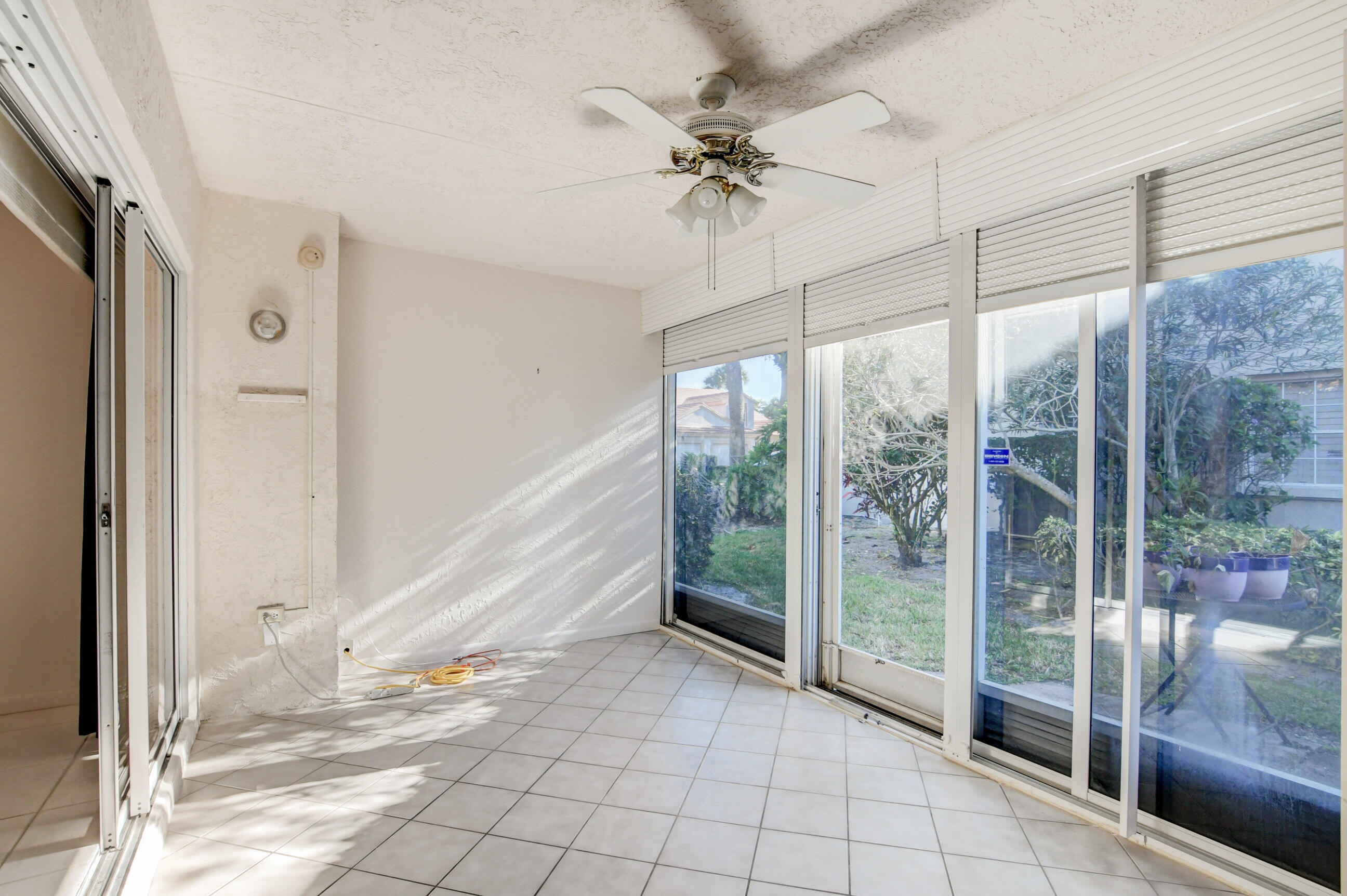 7566 Red Ruby Drive Delray Beach, FL 33446 - Photo 31 of 44 a view of an entryway with a glass door