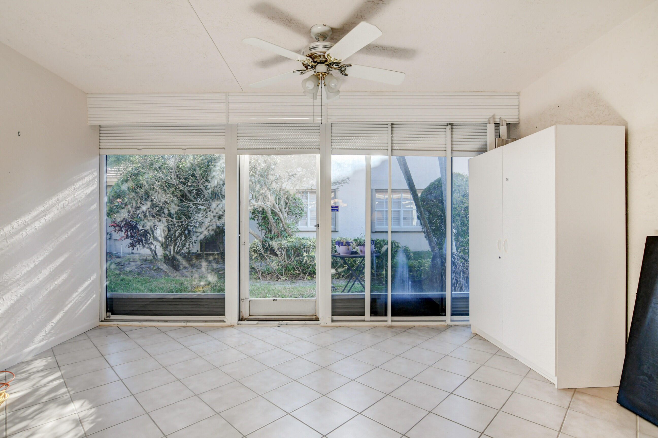 7566 Red Ruby Drive Delray Beach, FL 33446 - Photo 32 of 44 a view of an empty room with a window