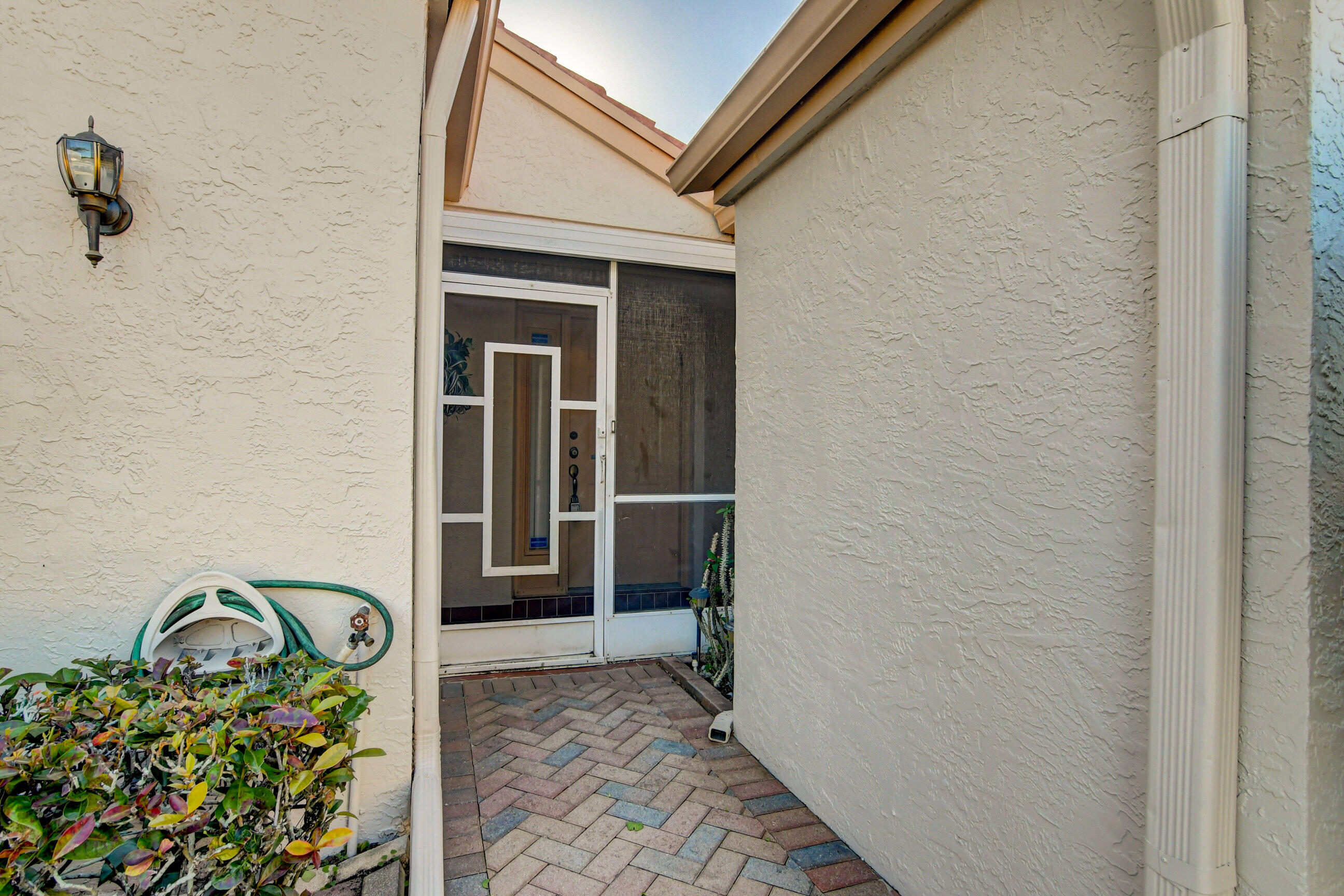 7566 Red Ruby Drive Delray Beach, FL 33446 - Photo 4 of 44 a front view of a house