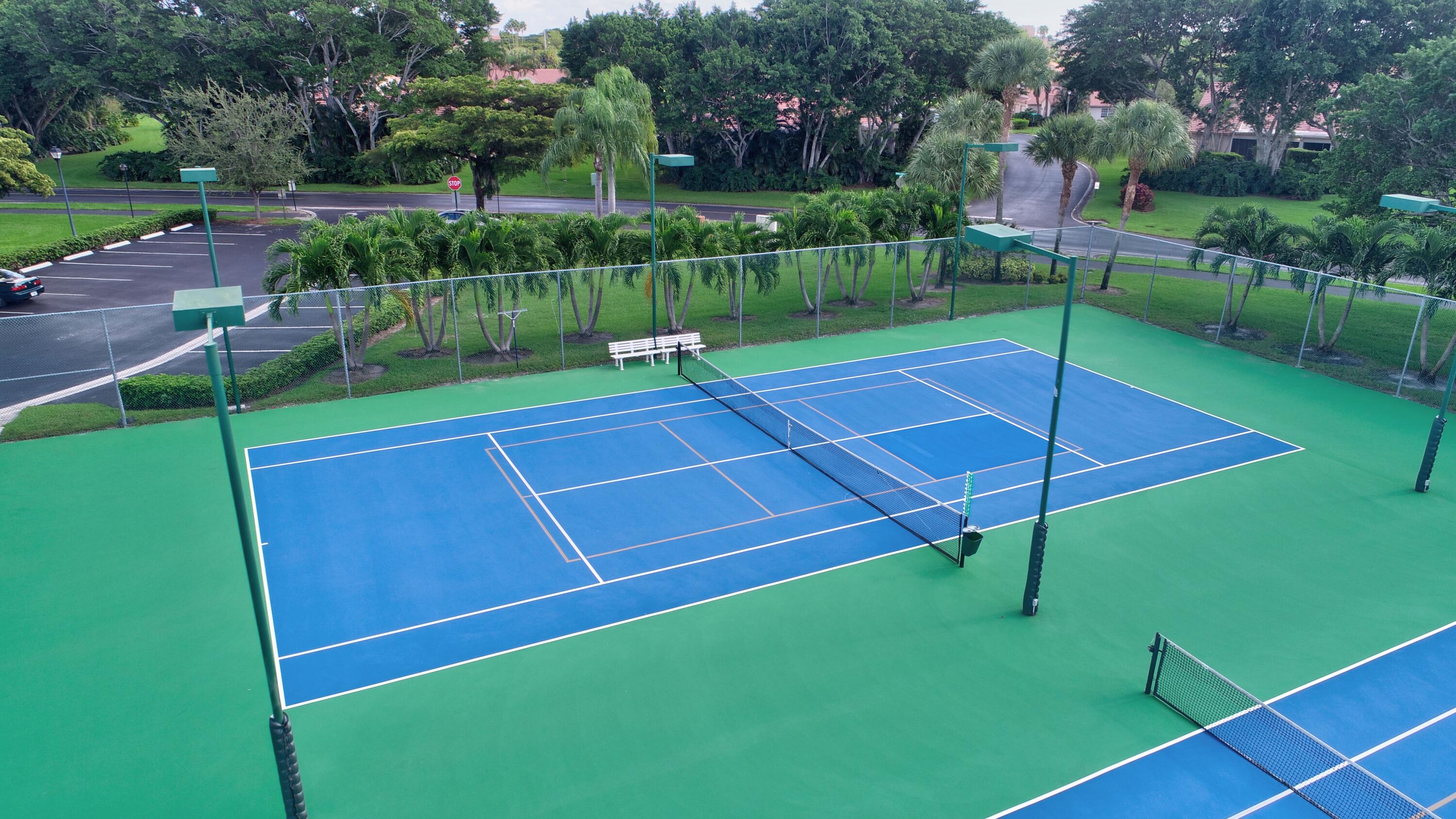 7566 Red Ruby Drive Delray Beach, FL 33446 - Photo 41 of 44 a view of a tennis court