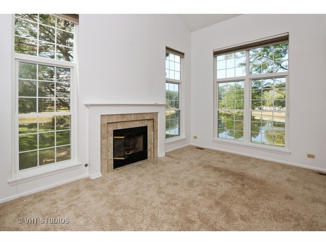 17814 Braewick Road, Unit 17814 Gurnee, IL 60031 - Photo 2 of 10 a view of an empty room with a window