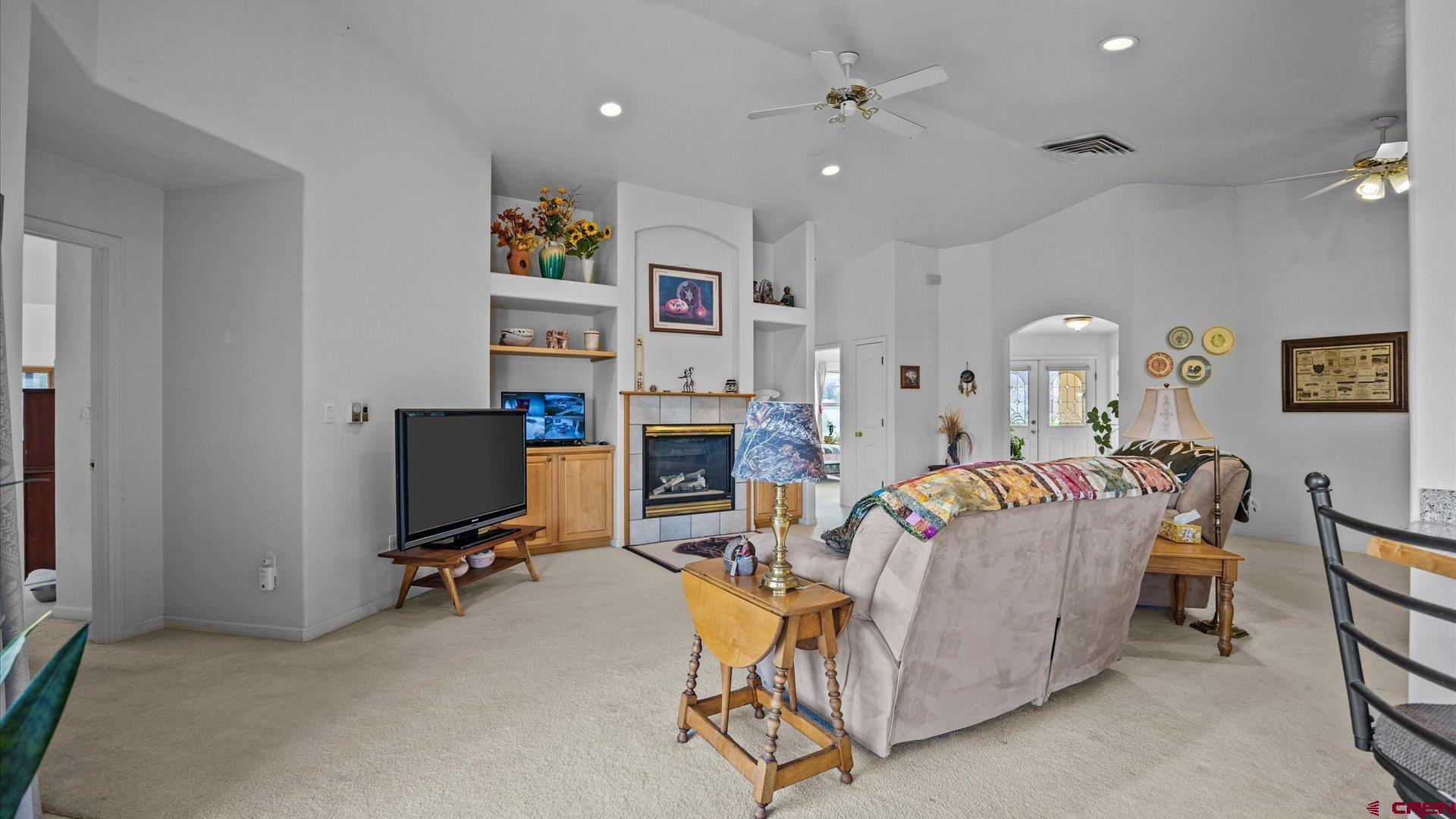 18 Willow Creek Court Parachute, CO 81635 - Photo 11 of 31 a living room with fireplace furniture and a flat screen tv