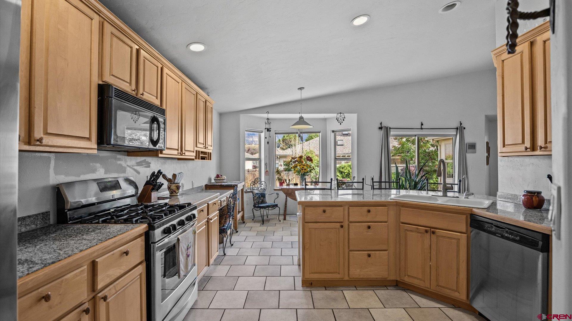 18 Willow Creek Court Parachute, CO 81635 - Photo 14 of 31 a kitchen with a sink stove and cabinets