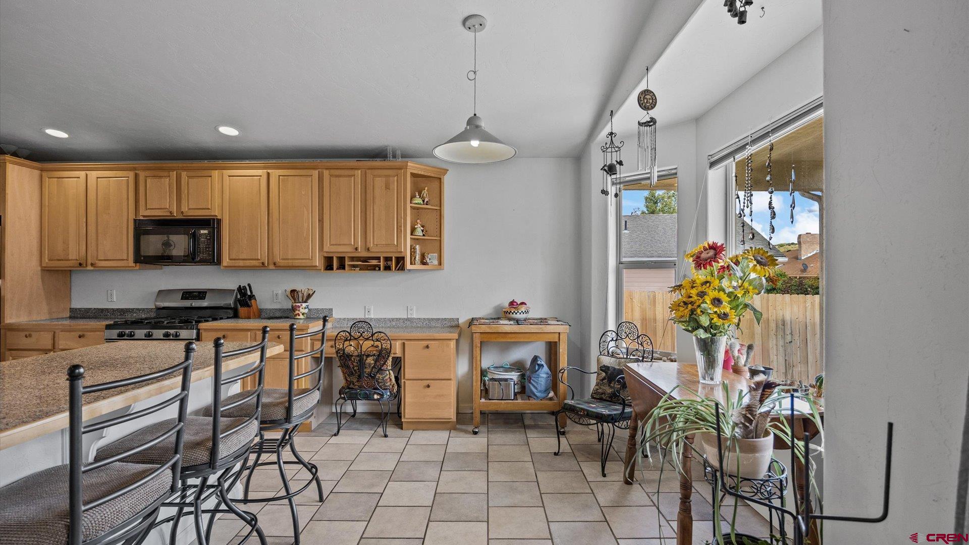 18 Willow Creek Court Parachute, CO 81635 - Photo 16 of 31 a kitchen with stainless steel appliances a table and chairs in it