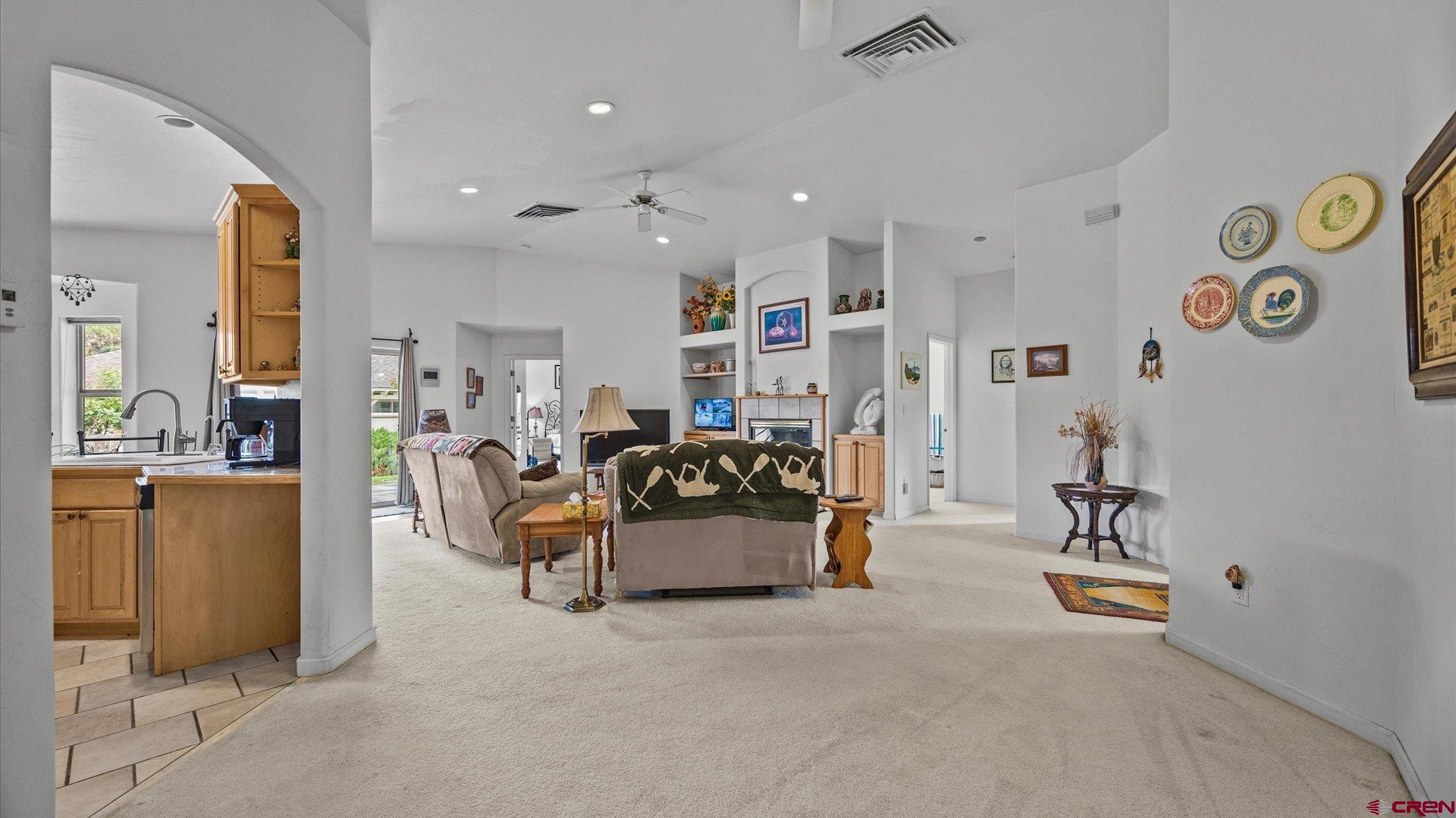 18 Willow Creek Court Parachute, CO 81635 - Photo 17 of 31 a living room with furniture and a chandelier